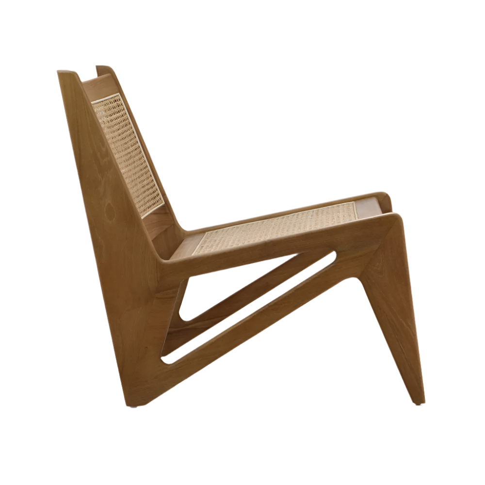 Side view of a low-slung lounge chair with a natural teak solid wood frame and woven cane seat and back, featuring angular carved supports and a minimalist mid-century modern armless profile on a white background.