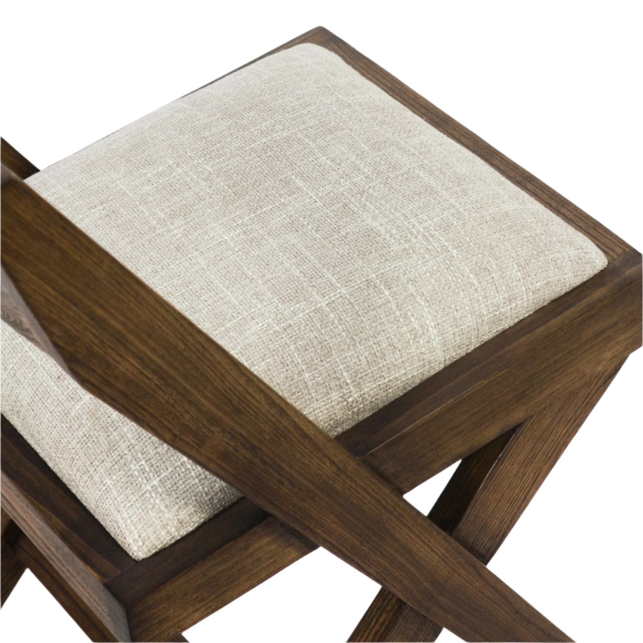 Close-up of a beige textured upholstered seat cushion set into a warm teak natural wood frame with visible wood grain and crossed X-style legs, highlighting the fabric weave and frame joinery.