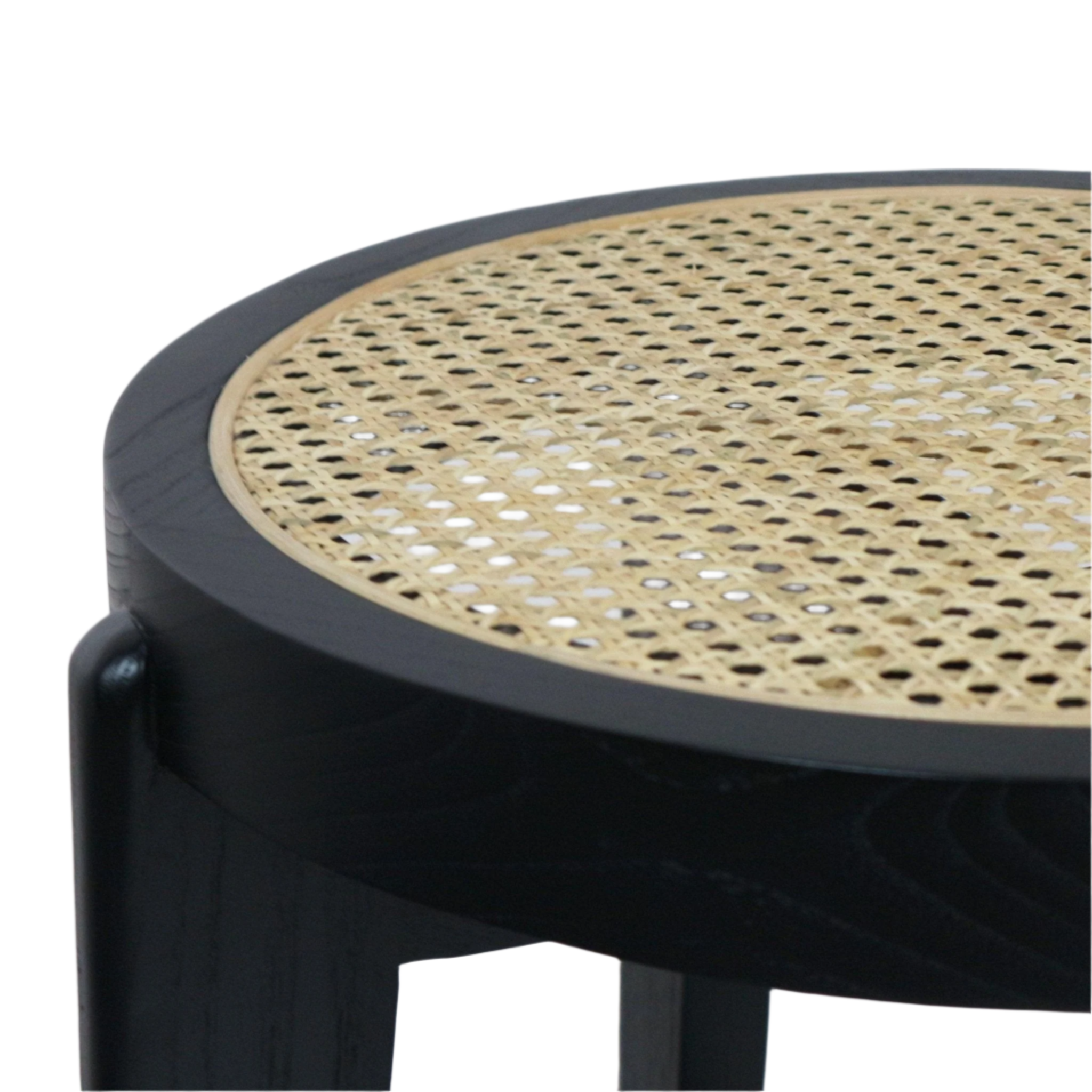 Close-up of a round stool top showing natural woven cane seating inset in a black solid wood frame with mid-century modern styling.