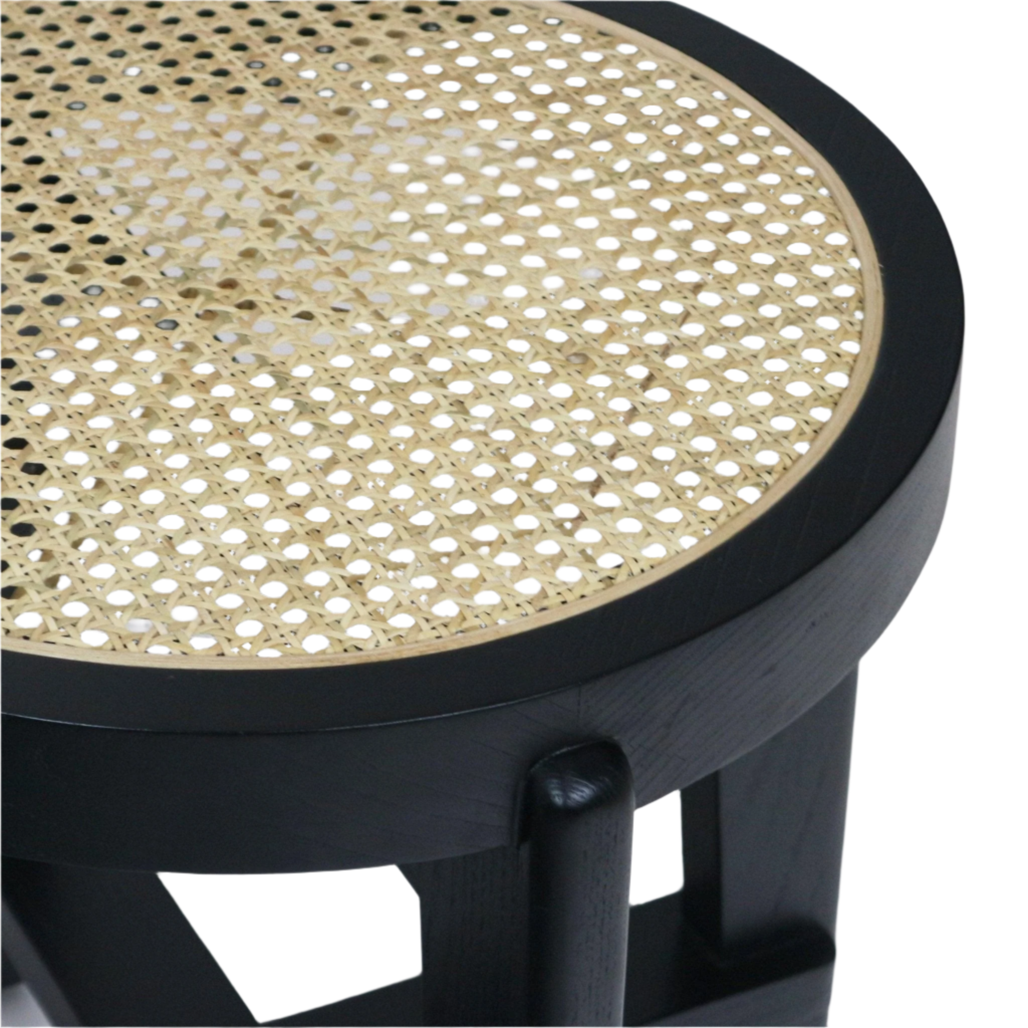 Close-up of a round natural cane-woven seat inset in a black solid wood stool frame, highlighting the rattan weave pattern and the black finished circular top and supporting legs.