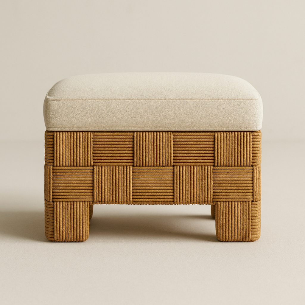 Front view of a small vanity stool with a cream boucle upholstered cushion set on a woven natural rattan base in a checkerboard pattern with short square legs, shown against a neutral background.