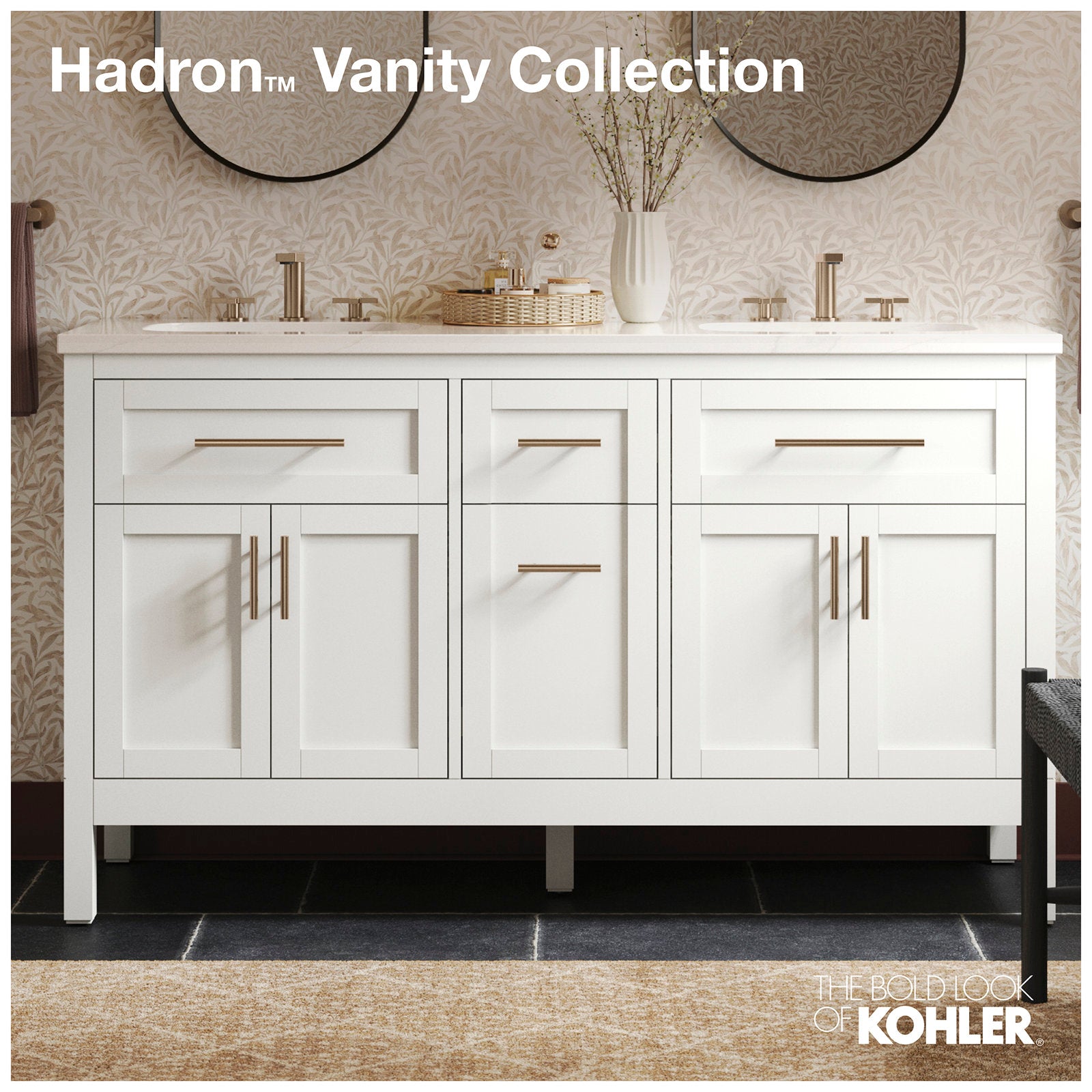 Freestanding modern solid wood bathroom vanity in white with a stone countertop, two undermount sinks, brushed brass hardware and shaker-style doors, shown with round mirrors and simple decorative accessories.