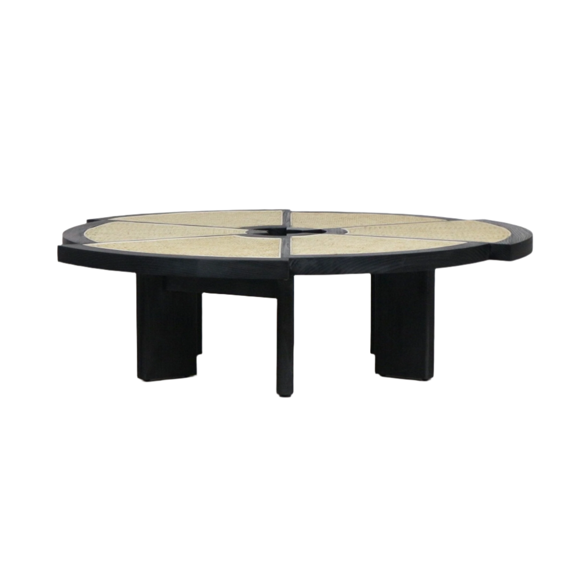 Low round modern coffee table with a black wood frame and segmented natural cane top arranged in wedge panels around a central circular opening, supported by four thick black legs.