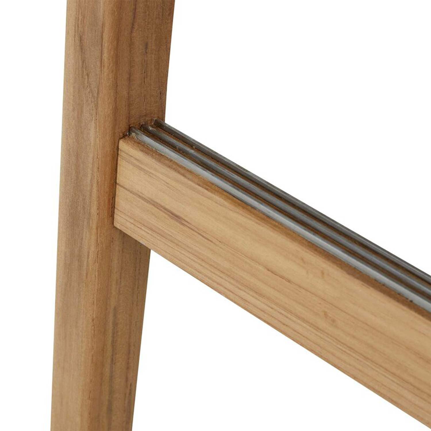 Close-up of a natural teak bar stool leg and horizontal footrest with three inset steel rails, highlighting the wood grain and joinery detail on an outdoor-style stool.