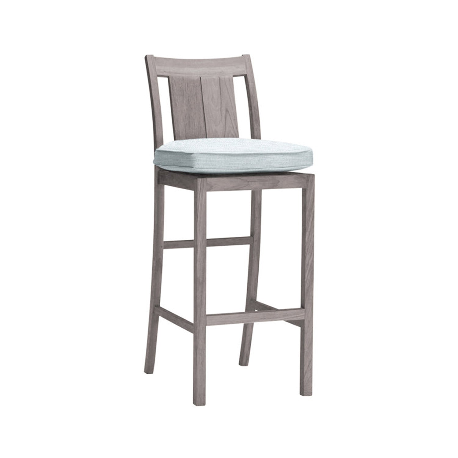 Armless teak outdoor bar stool with a slatted back, weathered natural finish and light blue cushioned seat on a solid wood frame with footrest rungs, coastal style for kitchen island or patio.
