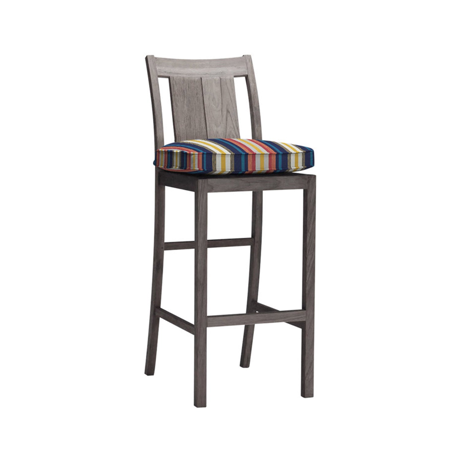 Armless teak outdoor bar stool with a slatted back and multicolor striped seat cushion, natural weathered teak finish, tall square legs and integrated footrest in a coastal style.