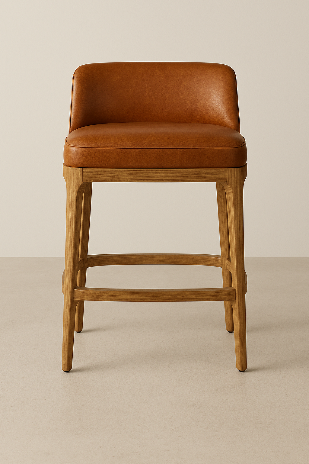 Front-facing contemporary counter-height bar stool with cognac leather upholstered low back and cushioned seat on natural oak legs and integrated footrest, shown against a neutral backdrop.