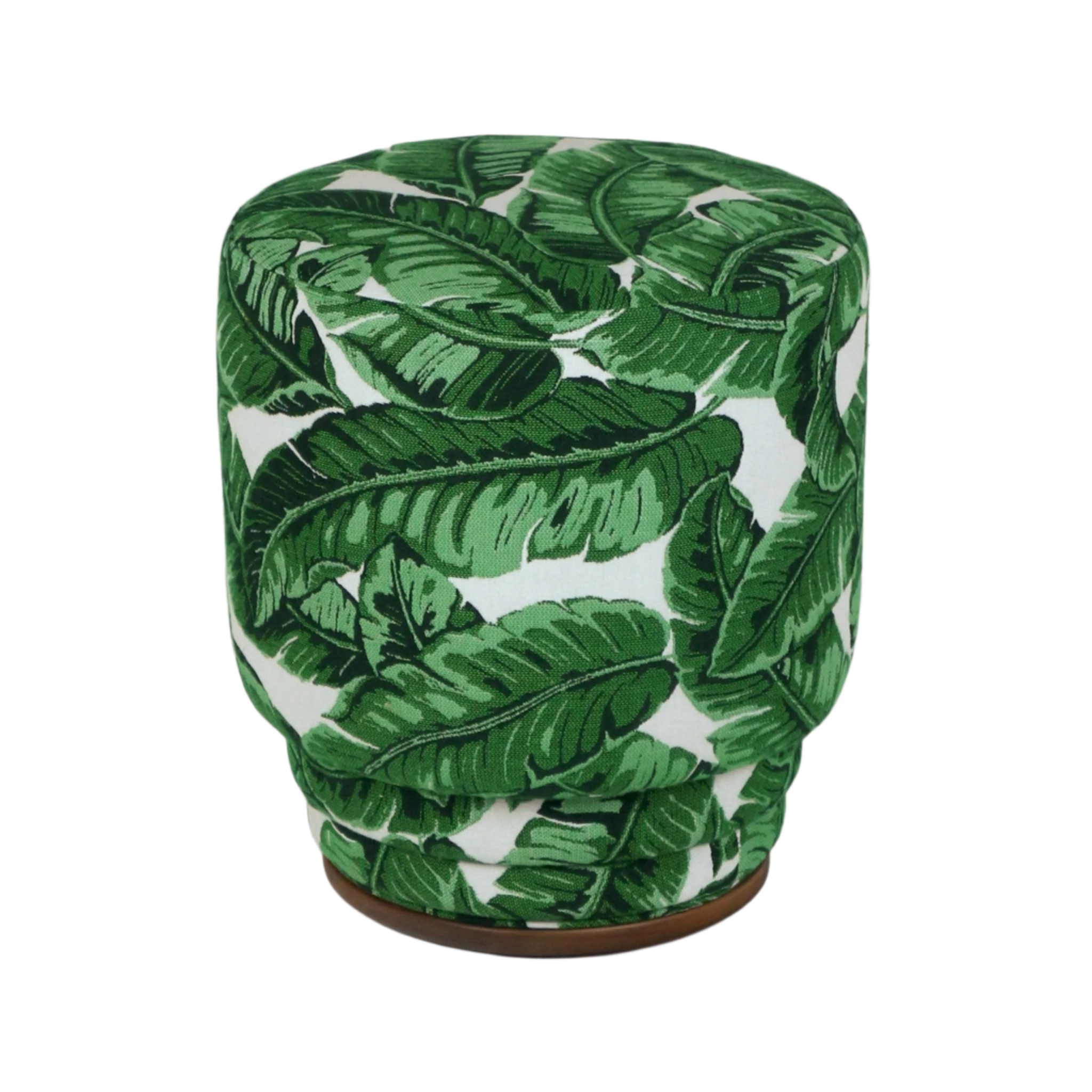 Round fabric ottoman covered in green tropical leaf print on a white background, with a cushioned top and a low wooden base, a modern outdoor-ready accent piece.