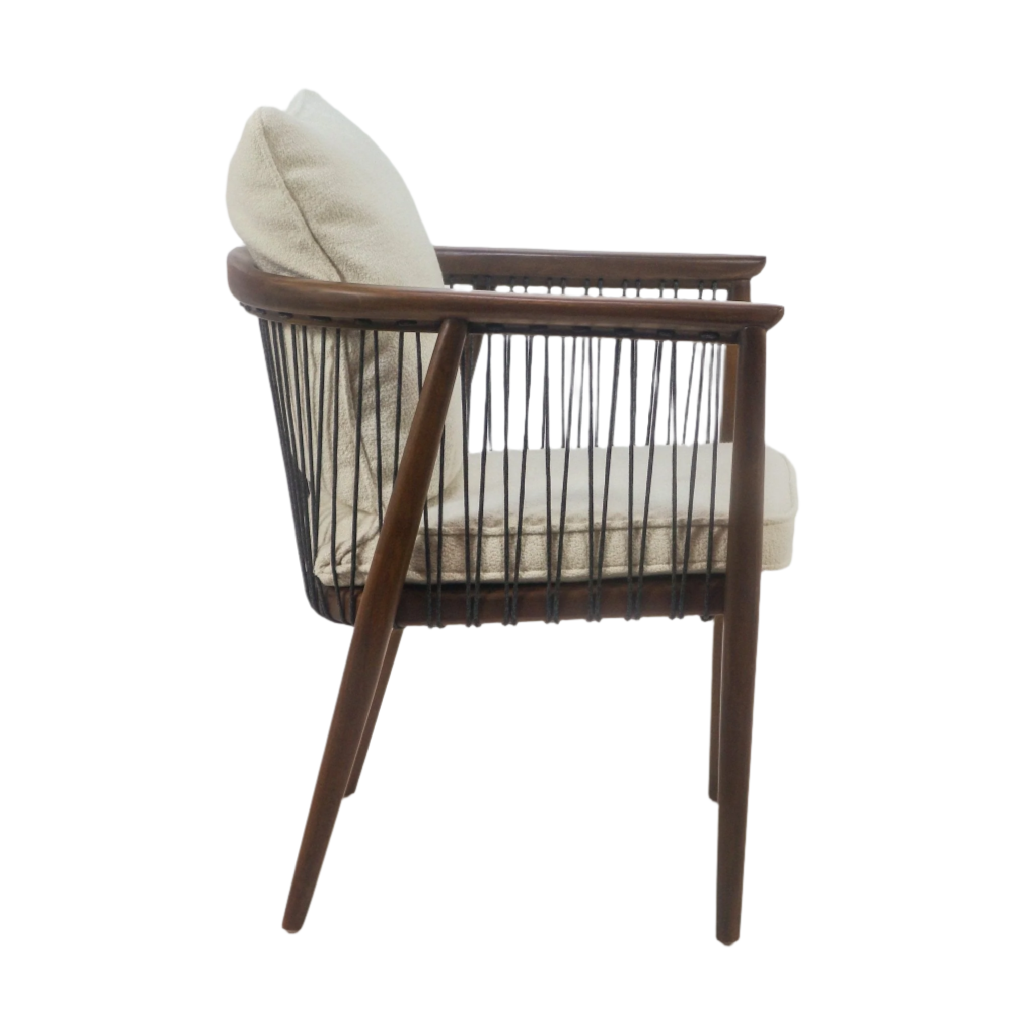 Side view of a mahogany solid wood dining chair with cream boucle seat and back cushions, curved wooden arms, vertical charcoal rope sides and angled wooden legs.