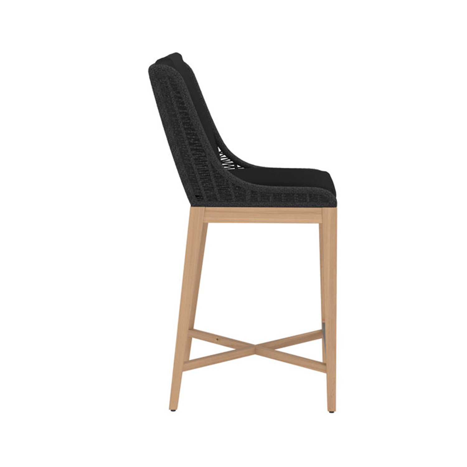 Side profile of an armless outdoor bar stool with a teak wood frame, black woven back and black upholstered seat, and crossed teak stretcher footrest in a coastal style.
