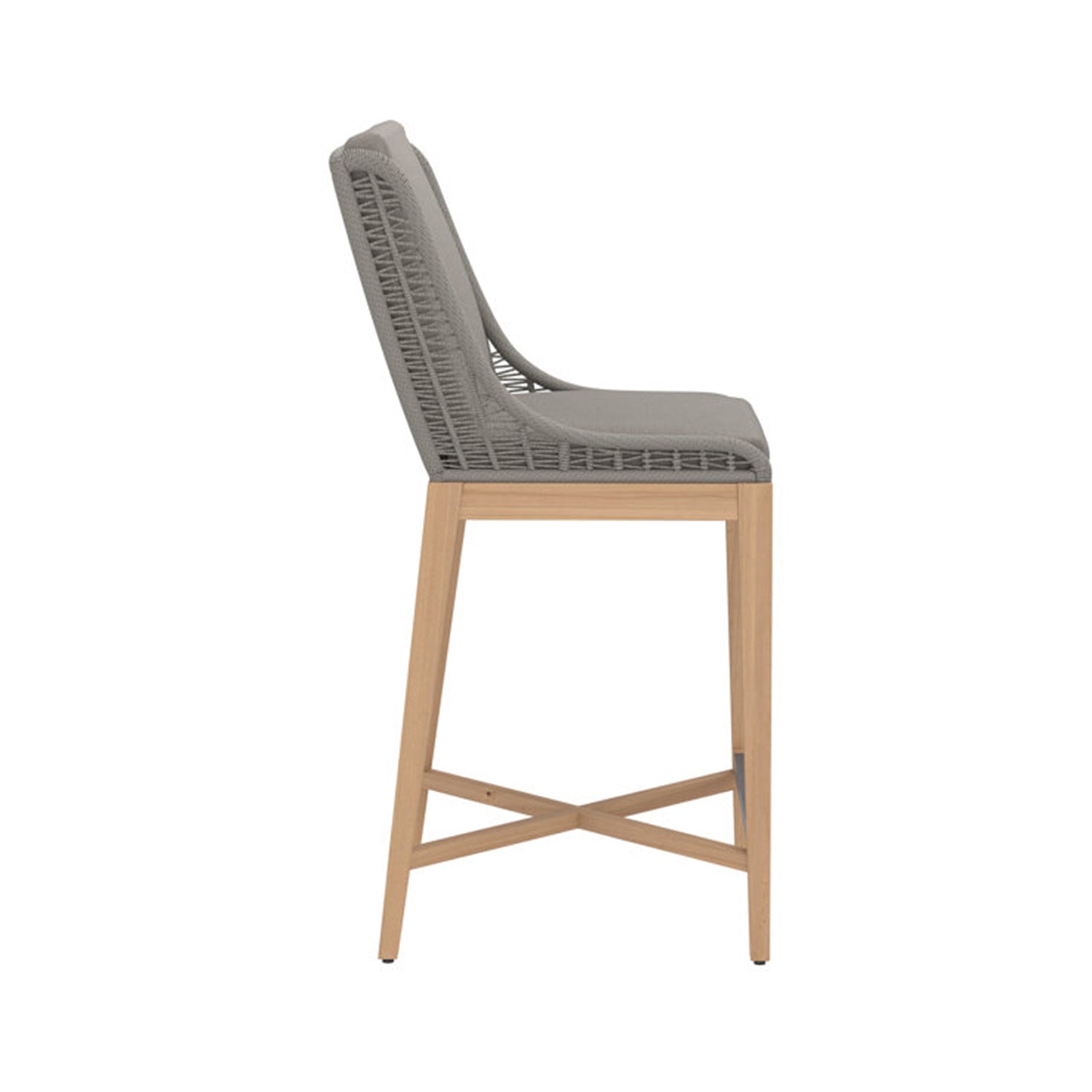Side view of an armless outdoor bar stool with a teak frame and crossed-stretcher legs, grey woven rope back and grey upholstered cushioned seat.