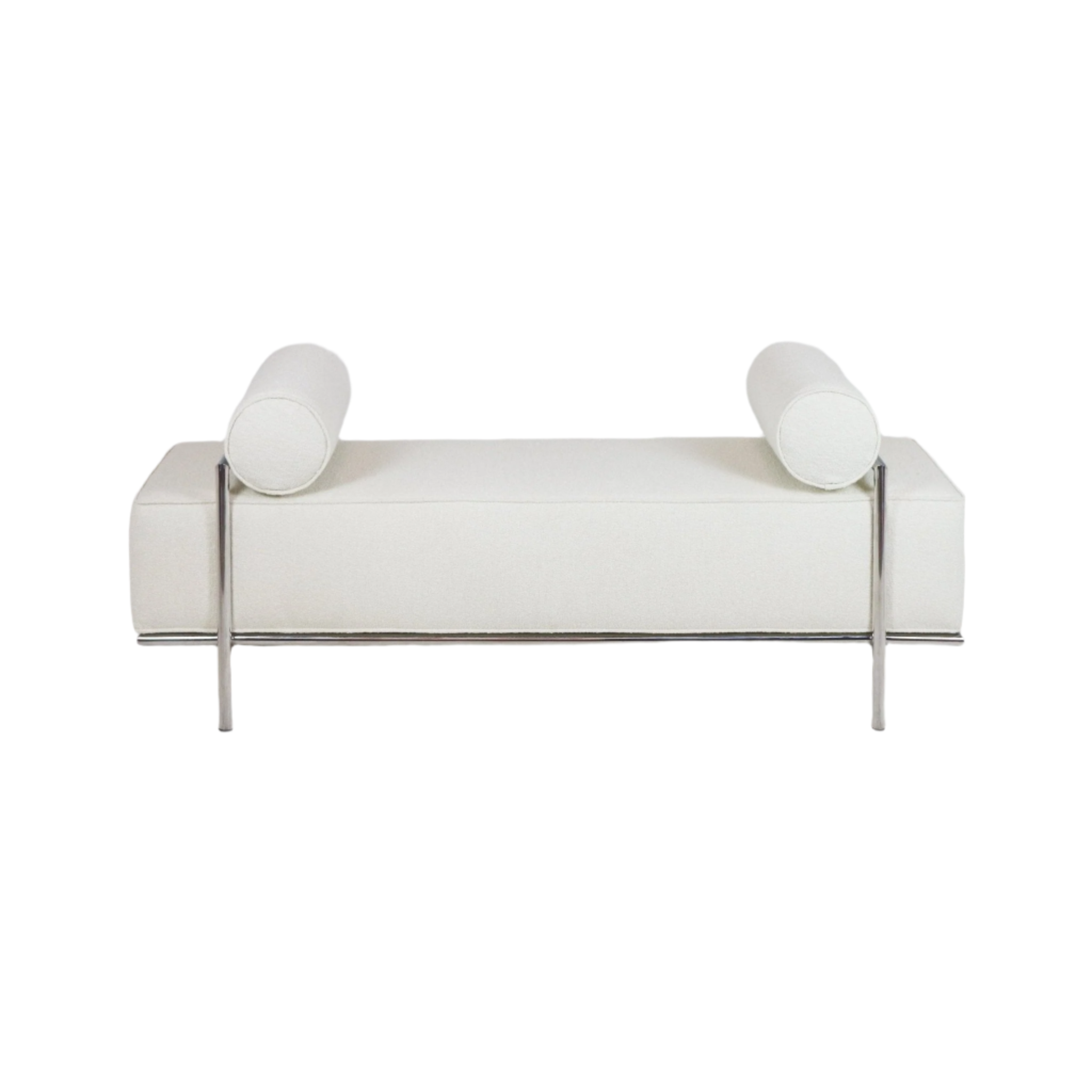 Low modern end-of-bed bench upholstered in white boucle fabric with two cylindrical bolster pillows and a polished stainless-steel frame and legs.