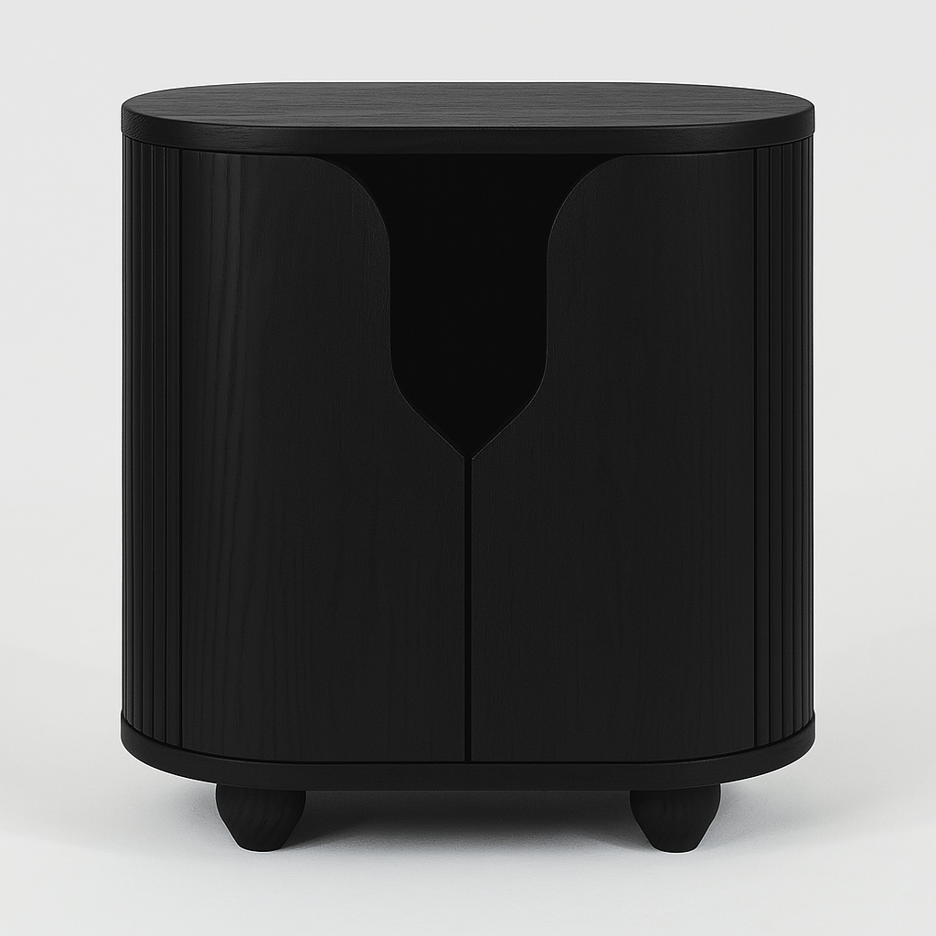 Black solid wood nightstand with rounded top, vertical fluted sides, central double-door front featuring a teardrop-shaped cutout handle, and short rounded feet.