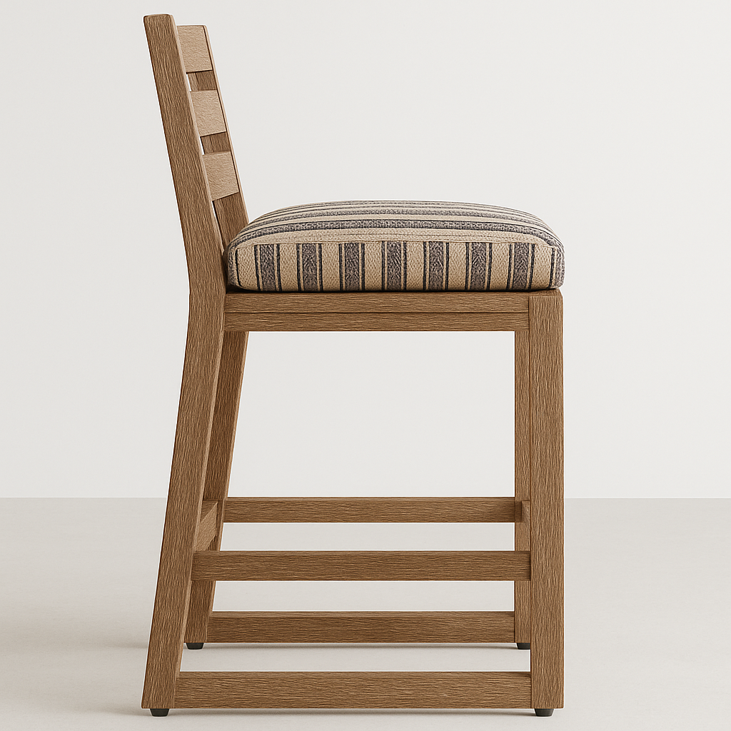 Side profile of an armless teak outdoor bar stool with a cushioned beige-and-charcoal striped seat, slatted ladder back and squared teak frame with horizontal footrest bars on a neutral background.