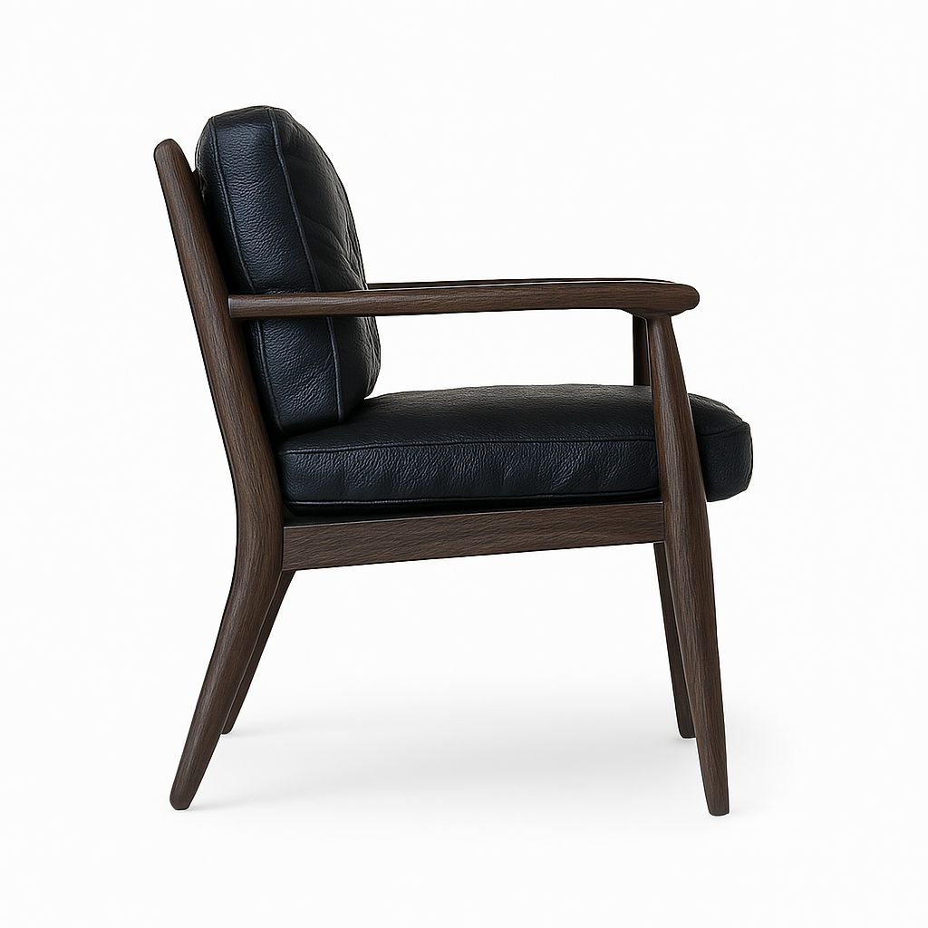 Side profile of a mid-century modern dining chair with black aged nubuck leather seat and back, sculpted walnut wood frame, tapered legs and slim wooden arms on a white background.