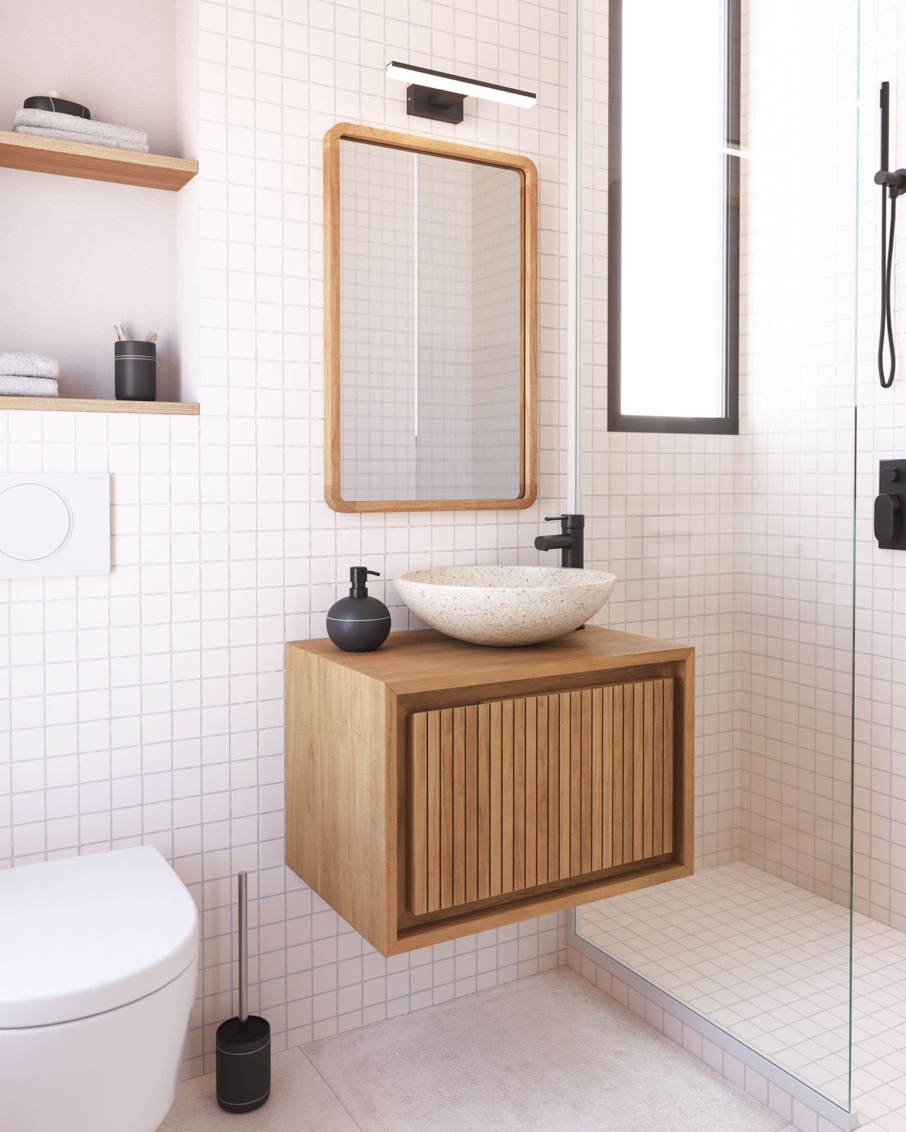Modern 24-inch floating solid wood vanity in natural wood with slatted front, stone vessel sink and matte black faucet, wood-framed mirror on a white square-tile wall next to a glass shower.