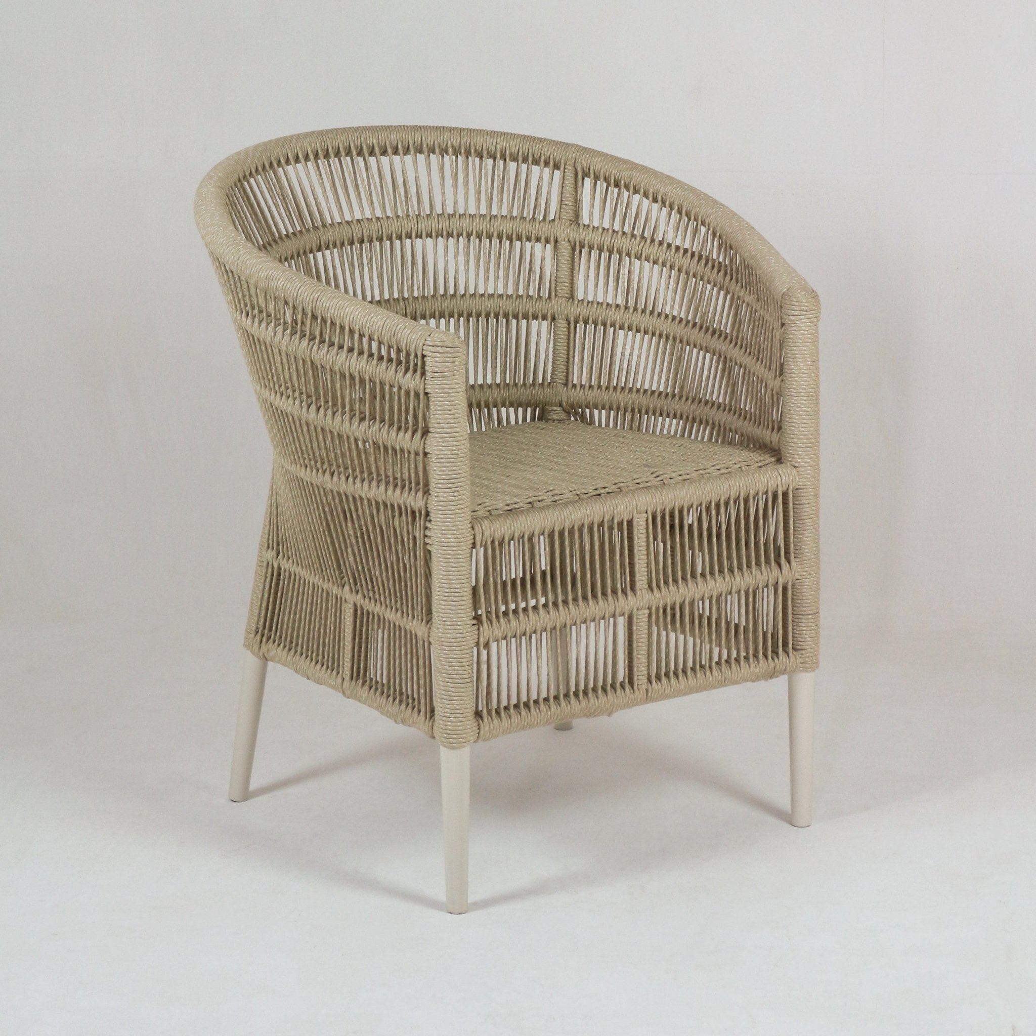 Beige rope-wrapped outdoor patio armchair with rounded back and woven seat, supported by slender off-white metal legs in a coastal-style design.