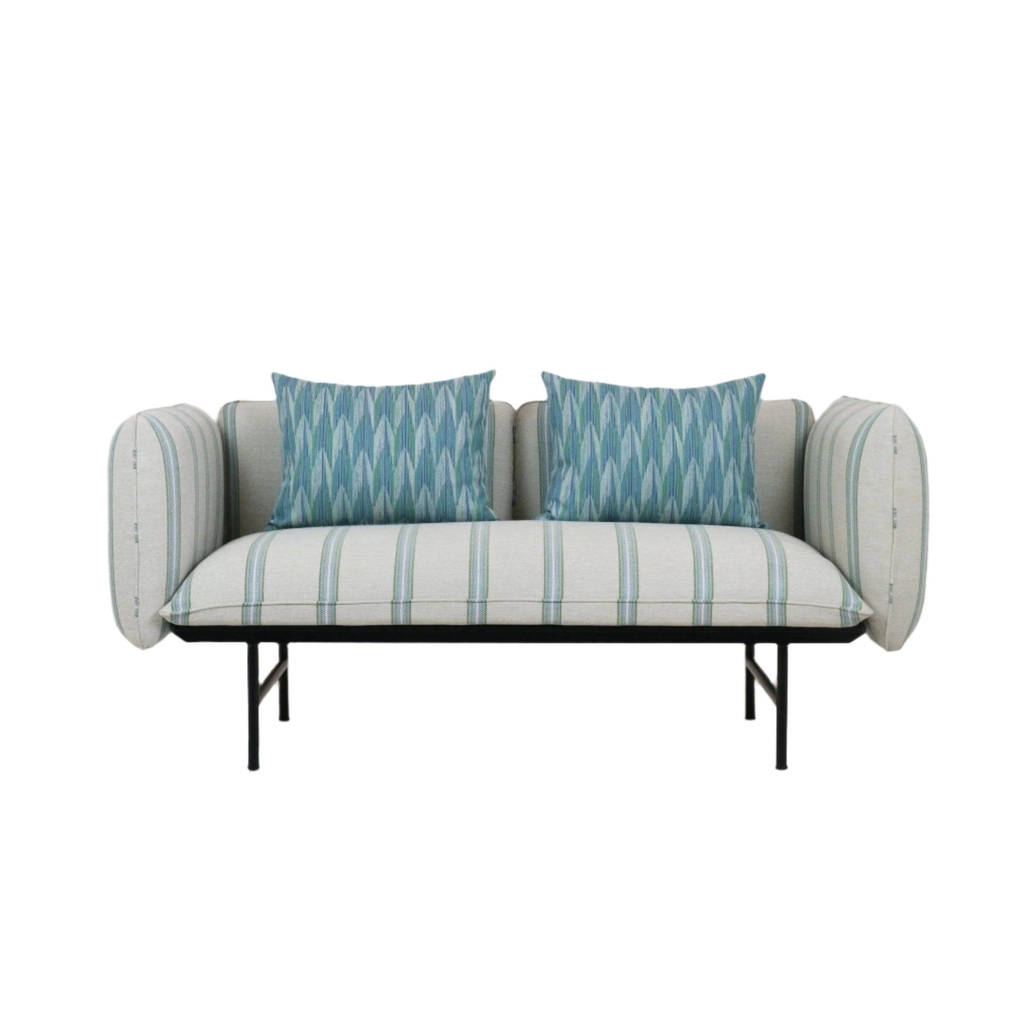 Two-seat outdoor sofa upholstered in cream striped fabric with rounded rolled arms, two blue-green patterned throw pillows, and a slender black metal base and legs in a coastal contemporary style.
