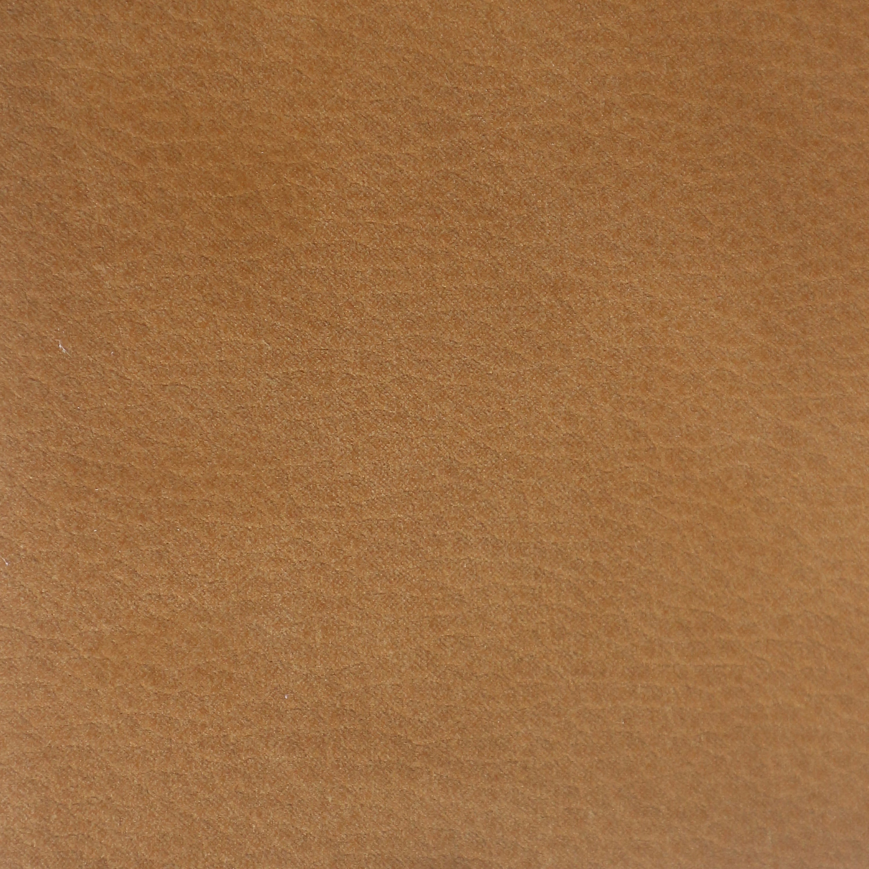 Close-up of tan nubuck synthetic upholstery showing a soft brushed nap and fine texture, suitable for an upholstered dining chair seat.