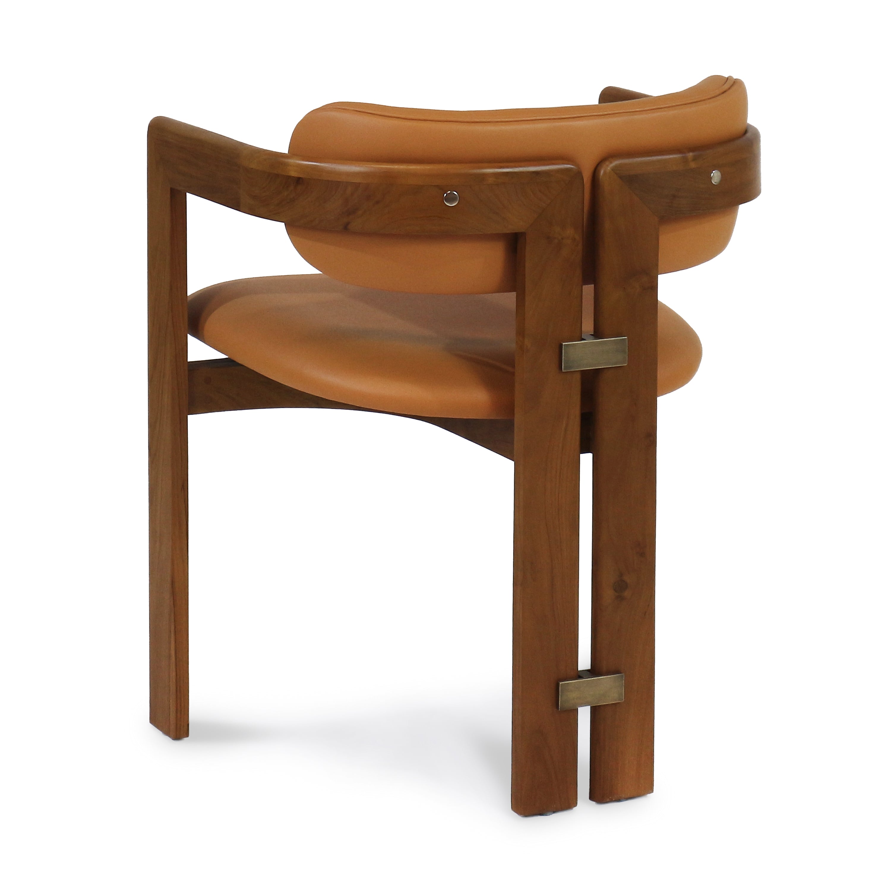 Rear three-quarter view of a mid-century modern walnut dining chair with tan nubuck leather seat and curved backrest, teak-finish wooden frame and rectangular brass accent plates.