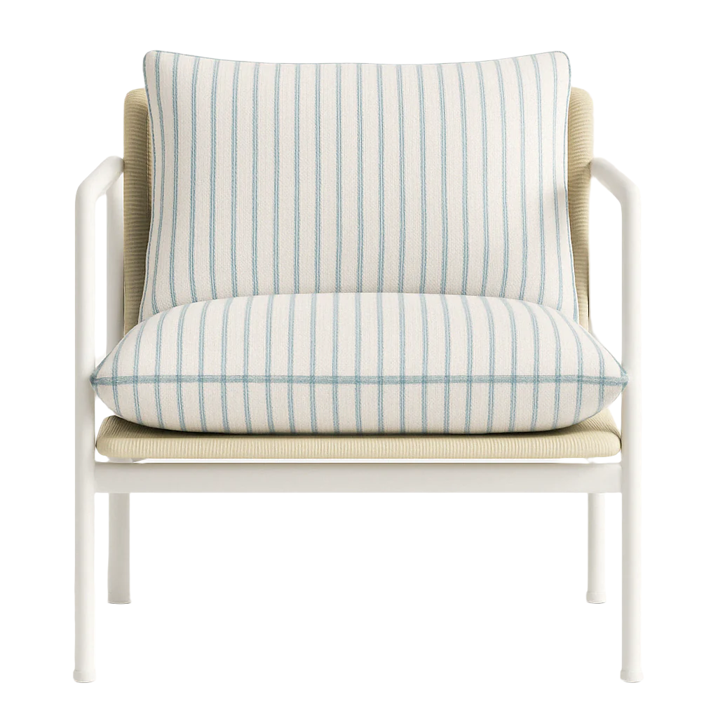 Front view of an outdoor coastal accent chair with a white aluminum frame, beige woven seat and back, and removable white fabric cushions featuring thin blue vertical stripes.