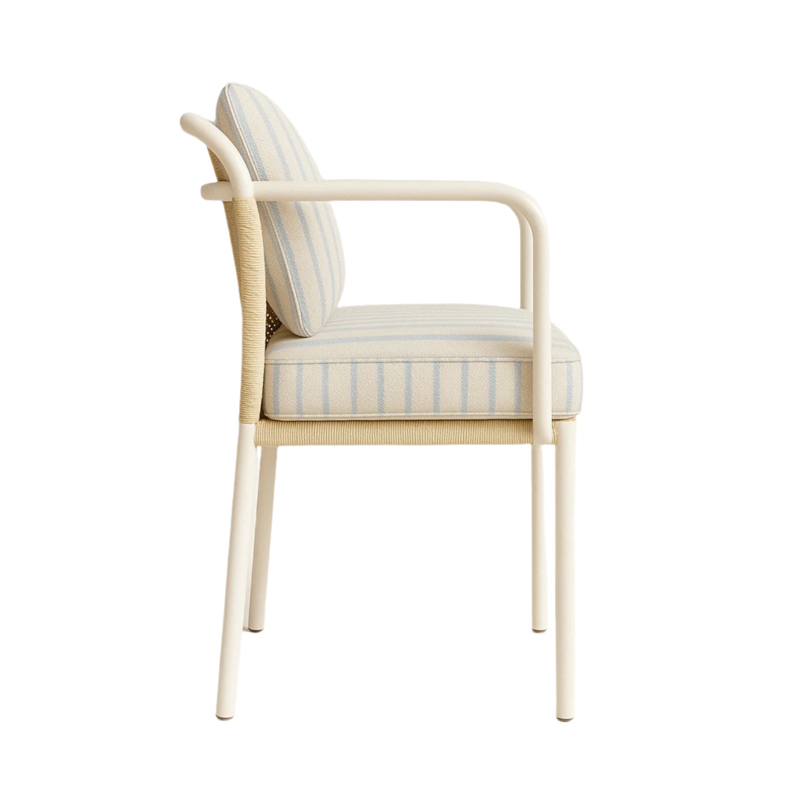 Side view of a coastal patio dining armchair with a white aluminum frame, wrapped synthetic cane detail and striped light-blue and cream fabric cushions, padded seat and back and rounded armrests.