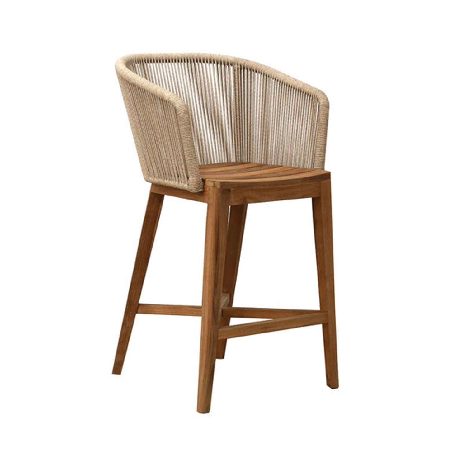 Natural teak outdoor bar stool with slatted teak seat and a curved woven natural-rope backrest, tapered legs and integrated footrest in a coastal modern style.