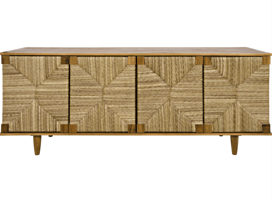 Long four-door sideboard in natural wood with geometric woven seagrass front panels, smooth wood top and tapered legs in a neutral coastal finish.