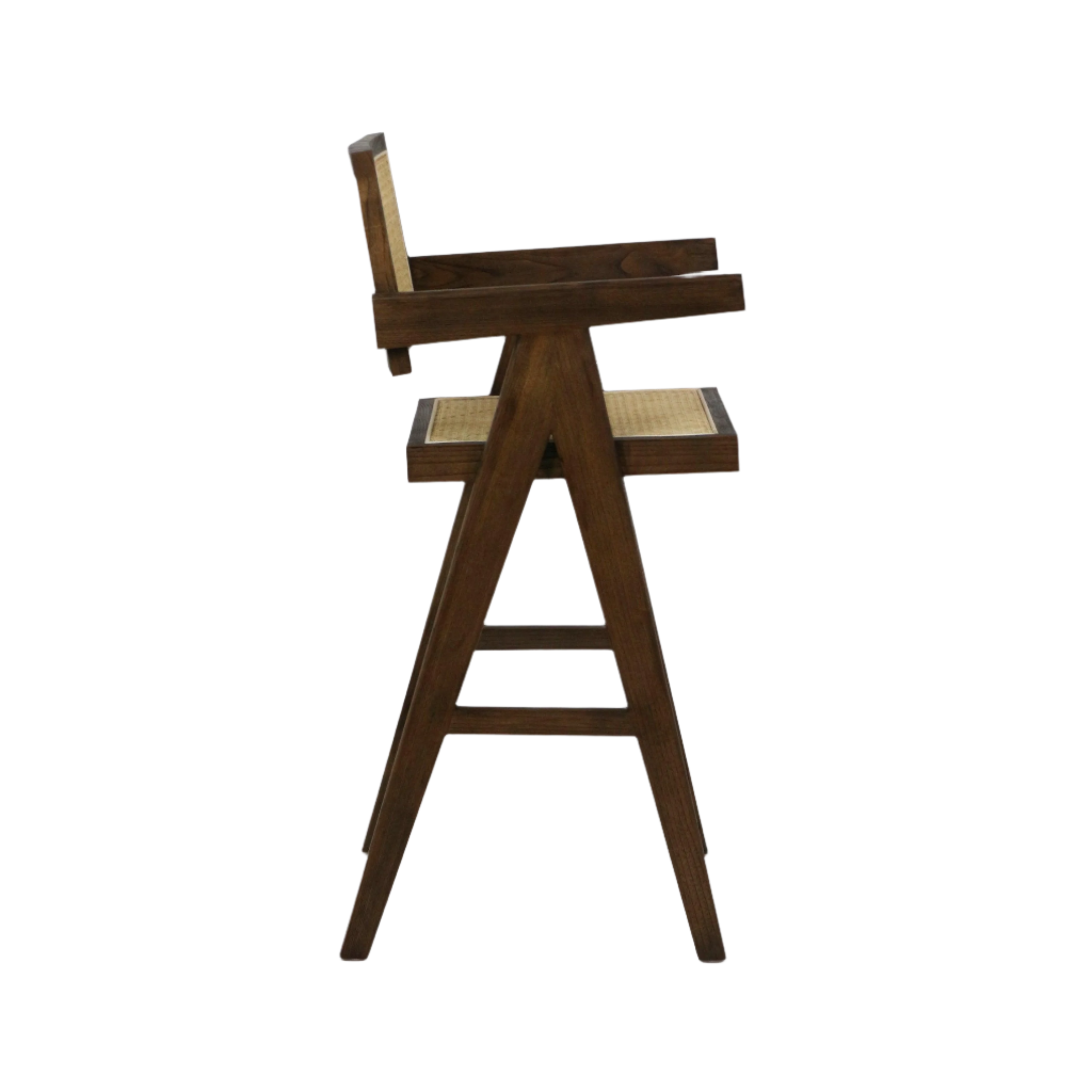 Side view of a midcentury-style wooden bar stool with A-frame legs, natural warm wood finish, woven rattan cane seat and backrest, short armrests and horizontal stretchers acting as a footrest.