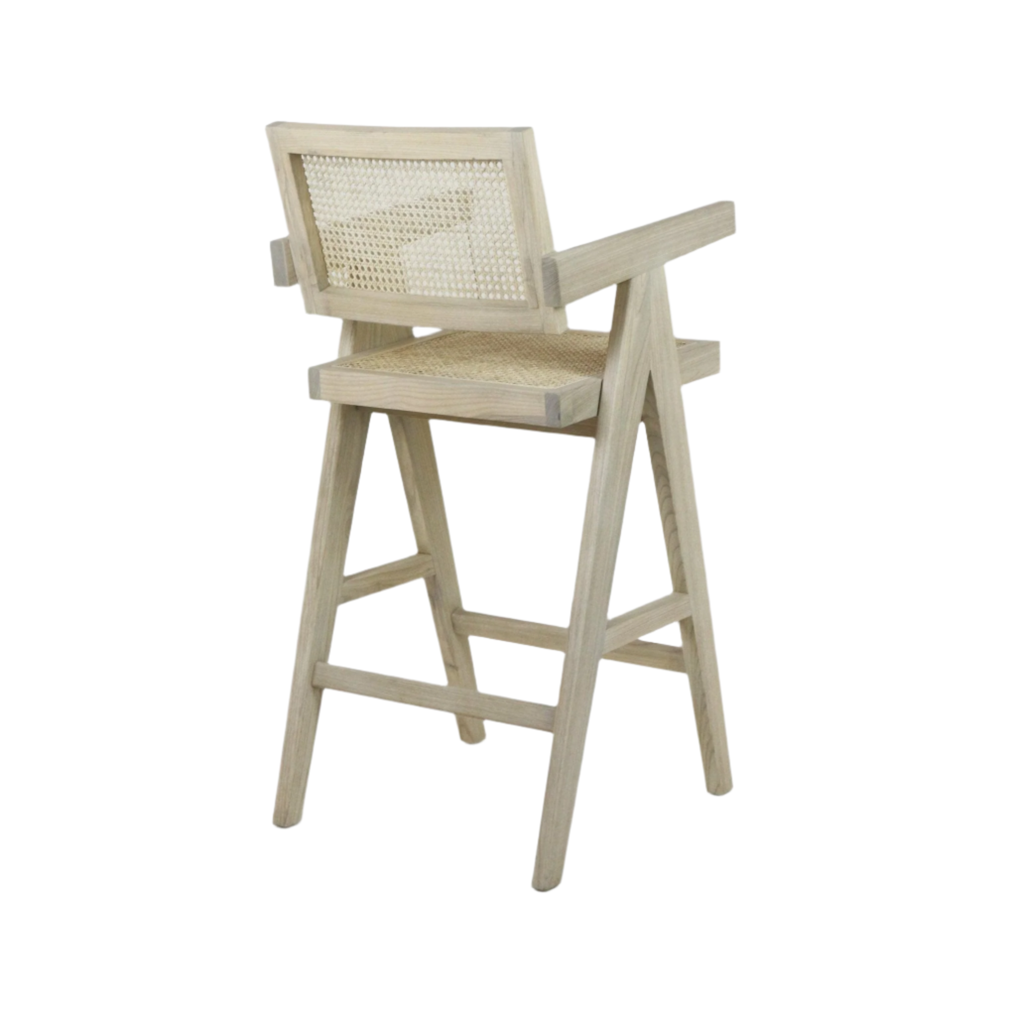 Natural blonde wood bar stool with woven cane seat and back, mid-century modern angled frame with armrests and integrated footrest.