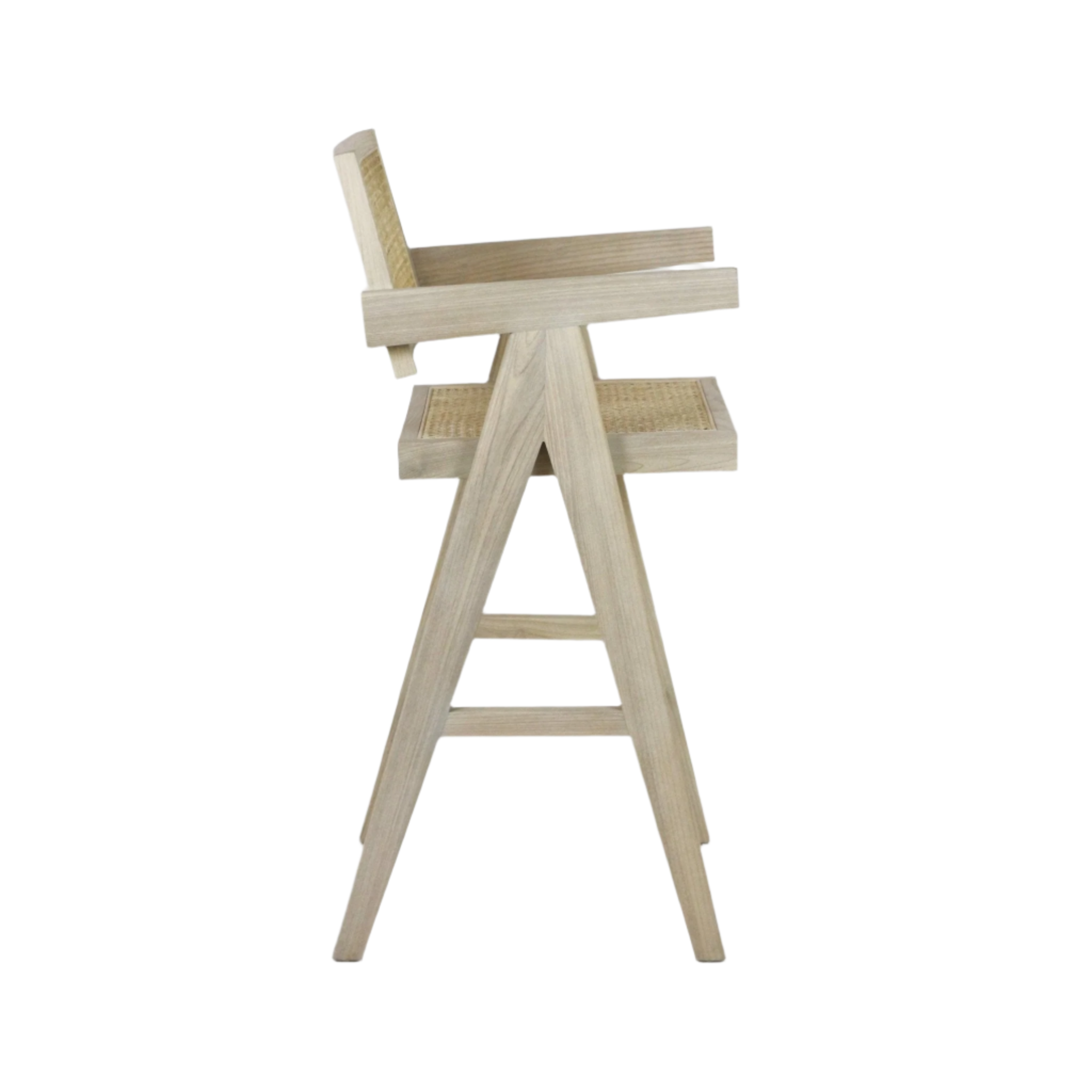 Side profile of a natural wood bar stool with woven rattan seat and back, A-frame legs, and straight wooden armrests in a mid-century modern style.