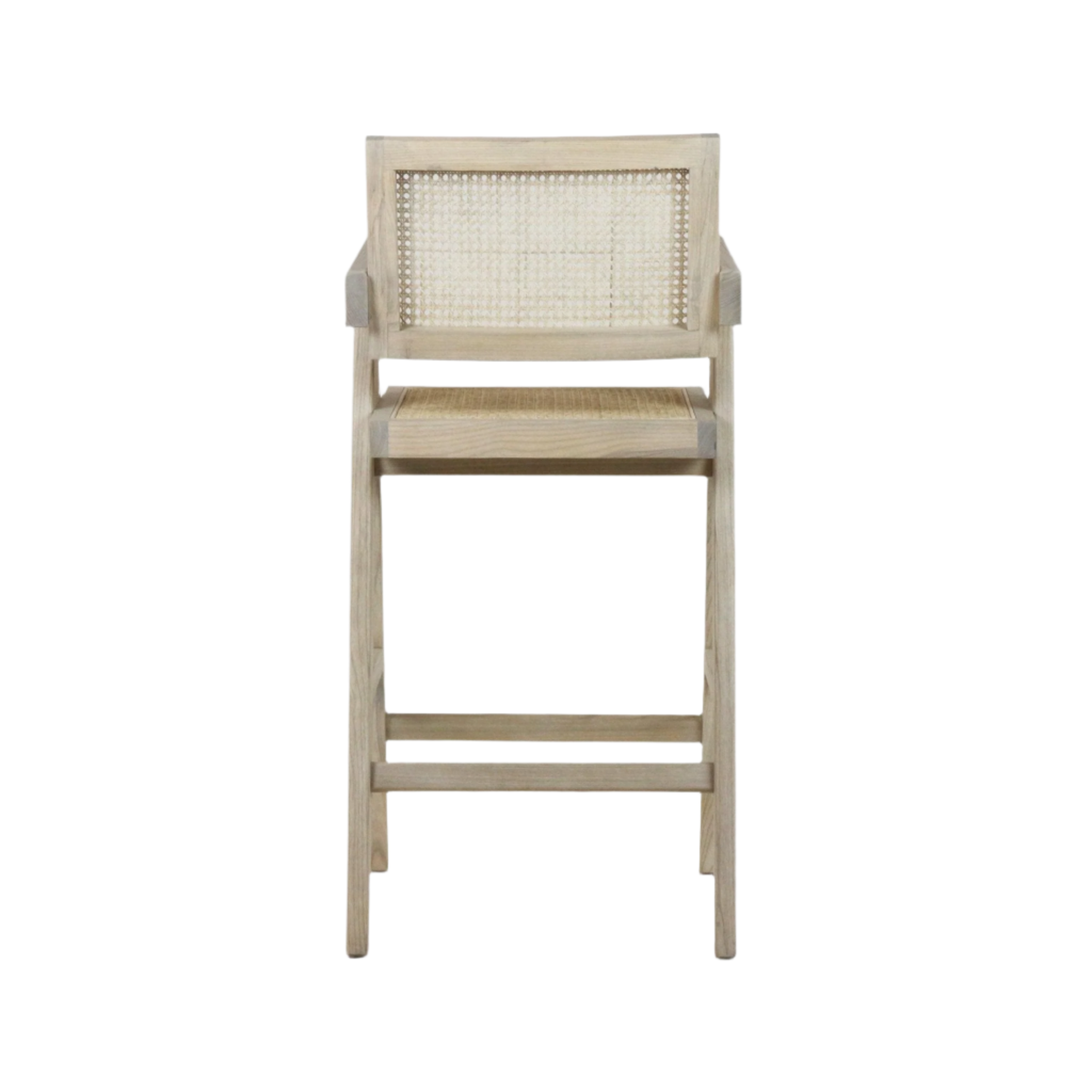Front view of a natural wood counter stool with woven rattan cane back and seat, light blonde finish, squared arm supports and horizontal footrest bars in a mid-century modern style.