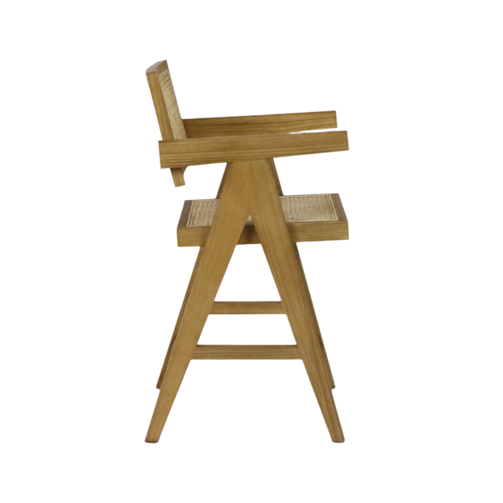 Side profile of a natural wood mid-century modern counter stool with A-frame legs, integrated armrests and rattan-woven seat and back in a blonde finish on a white background.