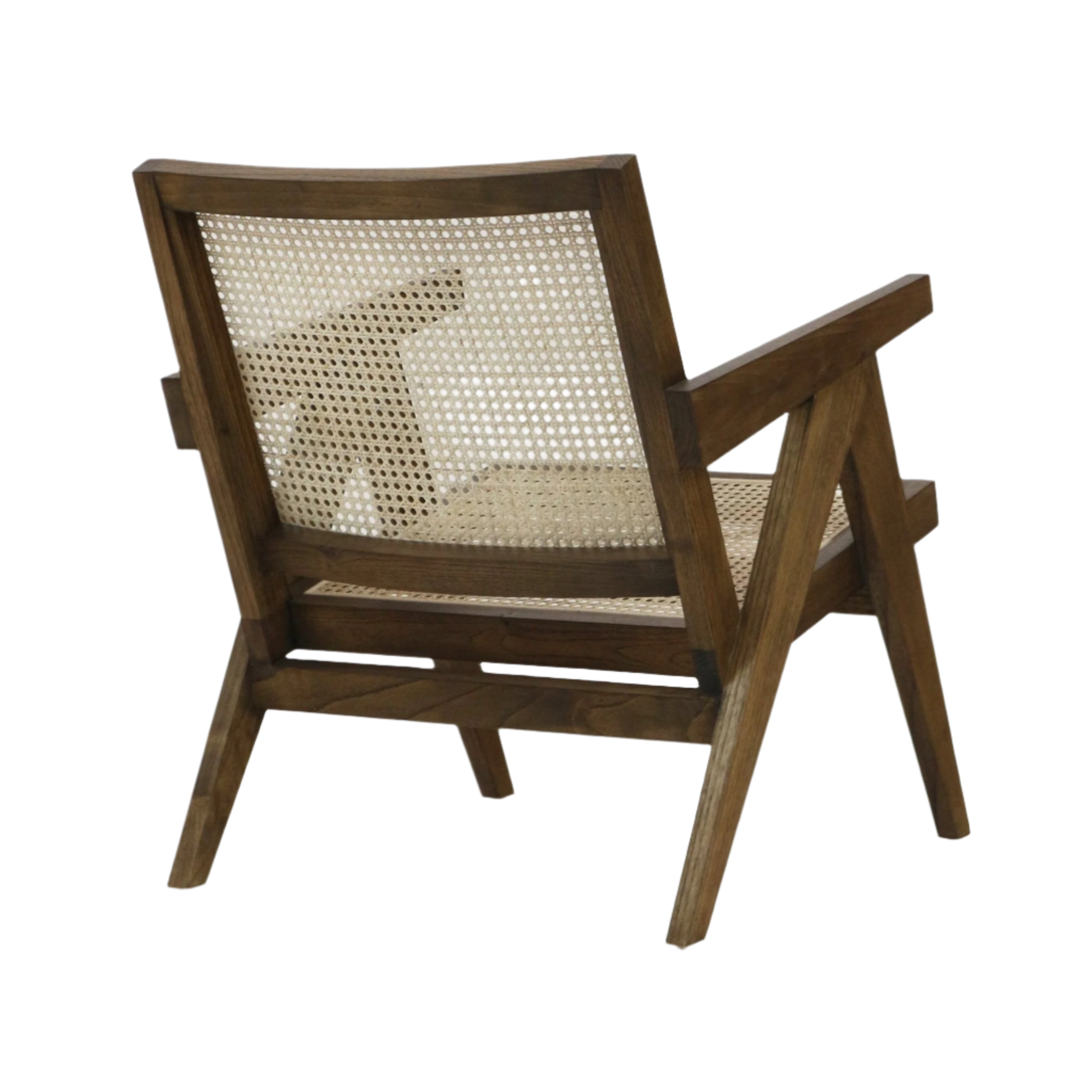 Rear three-quarter view of a solid natural wood lounge chair with woven rattan cane seat and full back, warm teak finish, angular mid-century modern frame with slanted arms and tapered legs.