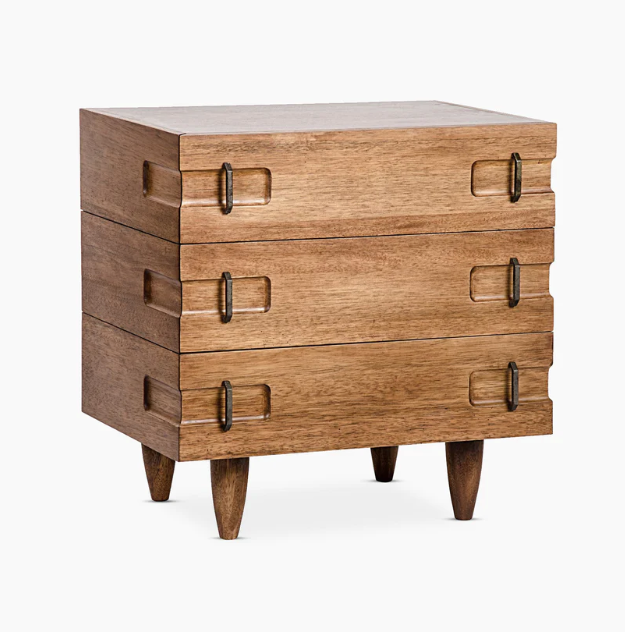 Solid oak three-drawer nightstand in a warm natural finish with recessed rectangular drawer insets, antique brass loop handles and tapered wood legs.