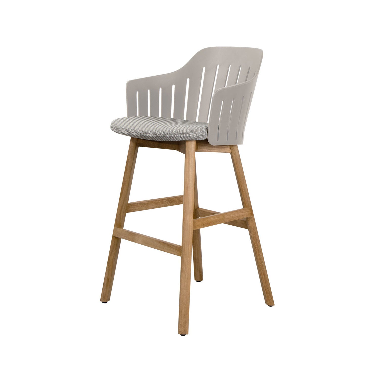 Outdoor bar stool with a solid teak four-leg base and footrest, light gray slotted shell back, and a rounded gray fabric cushion in a modern coastal style.