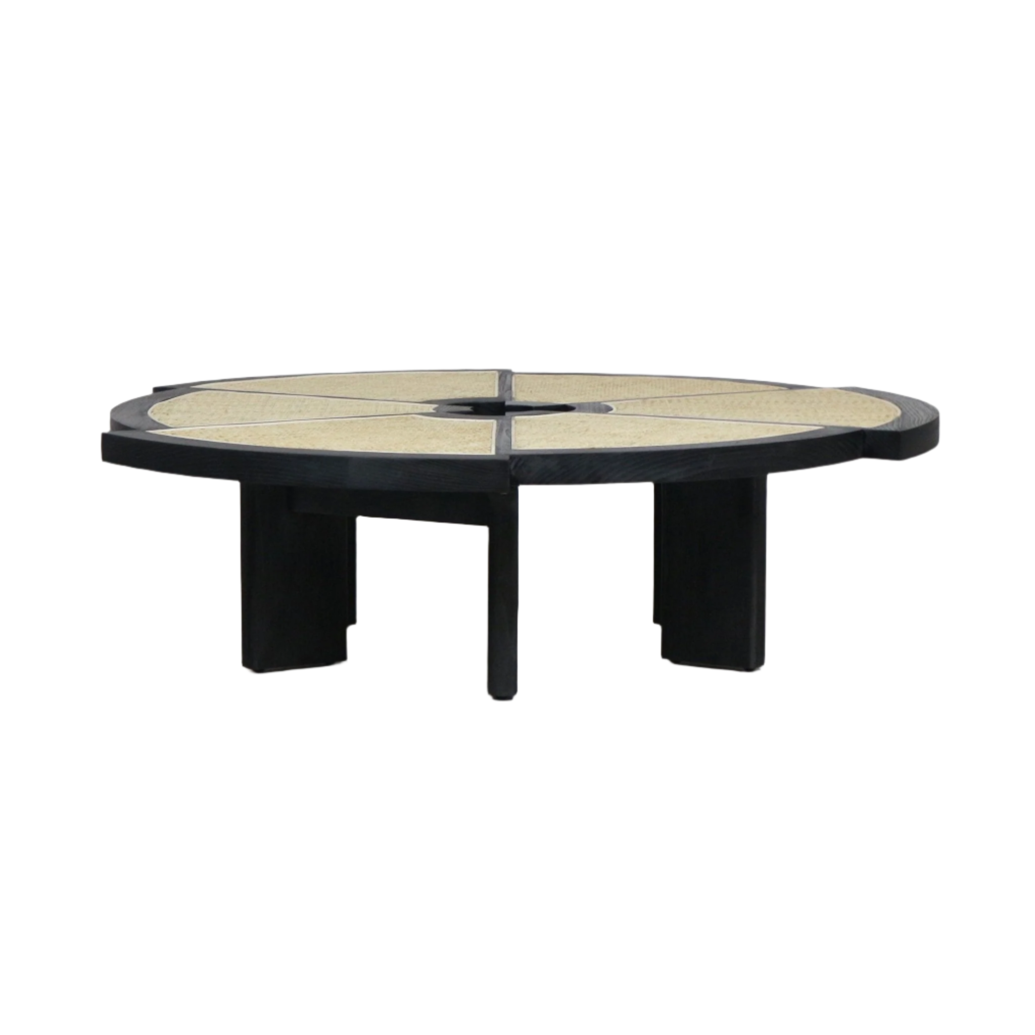 Low-profile round coffee table with a black solid-wood frame and four wide legs, featuring segmented natural cane inlay panels and a small central circular opening for a modern, mid-century inspired look.