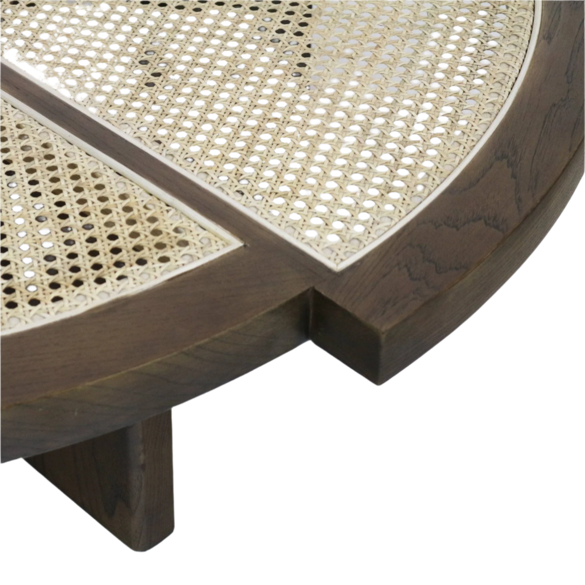 Close-up of a coffee table corner showing a natural woven cane top inset into a teak brown solid wood round frame with visible grain and a square support leg.