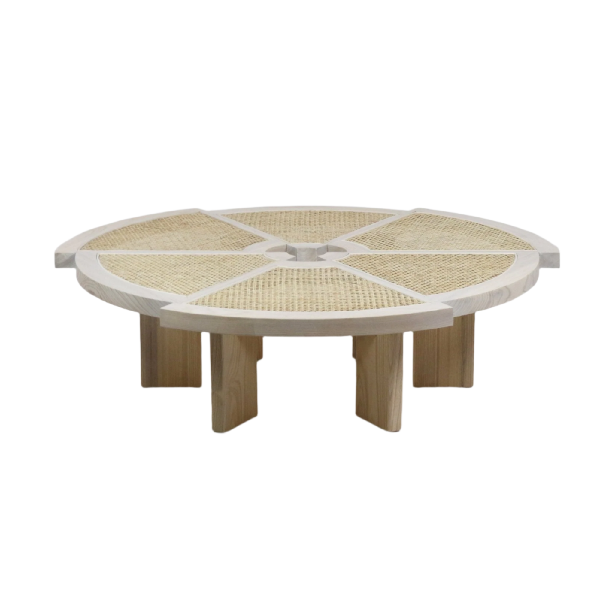 Low-profile round coffee table with a light natural solid wood frame and woven cane top arranged in radial segmented panels around a central hub, supported by chunky rectangular wood legs for a modern, mid-century look.
