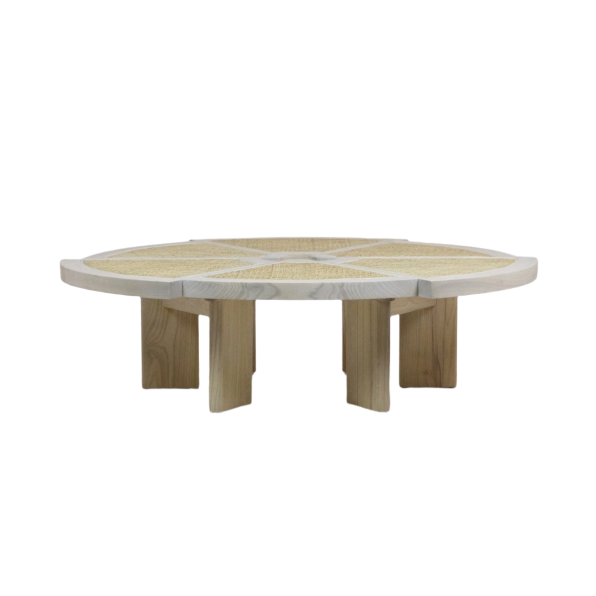 Low round coffee table in light natural solid wood with woven cane inset top divided into radial panels, supported by short block legs for a modern, mid-century inspired living room centerpiece.