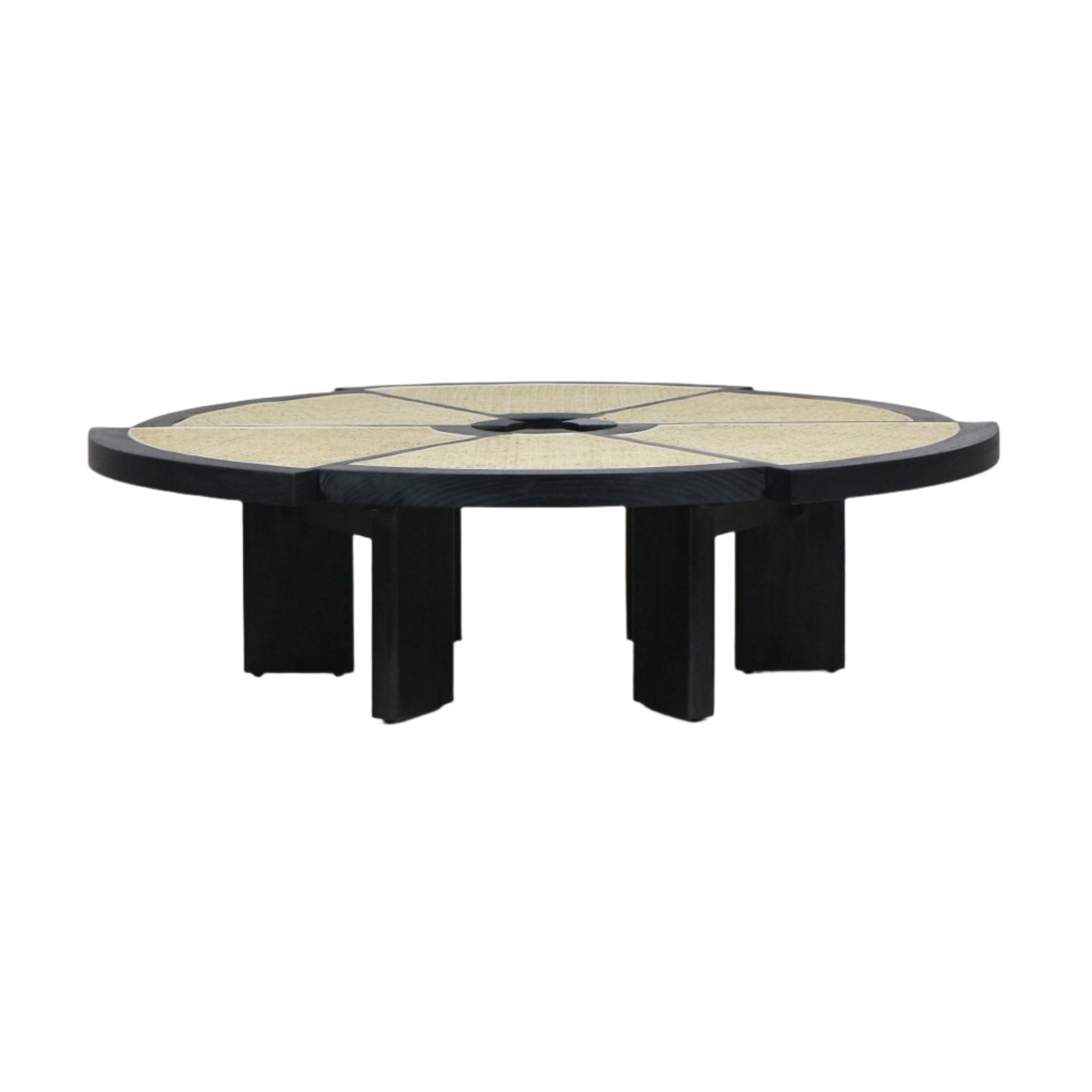 Low round coffee table with a black solid wood frame and segmented natural cane top forming a radial star pattern, supported by thick black block legs in a modern, mid-century-inspired silhouette.