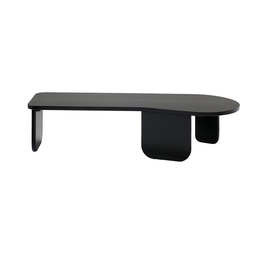 Low modern black solid wood coffee table with an elongated rounded top and three curved panel legs, minimalist contemporary design shown on a white background.