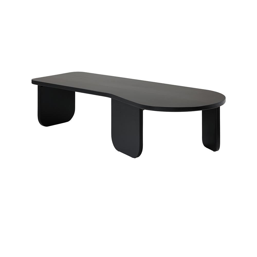 Low modern black solid wood coffee table with an elongated rounded rectangular top and three rounded panel legs in a minimalist contemporary style.
