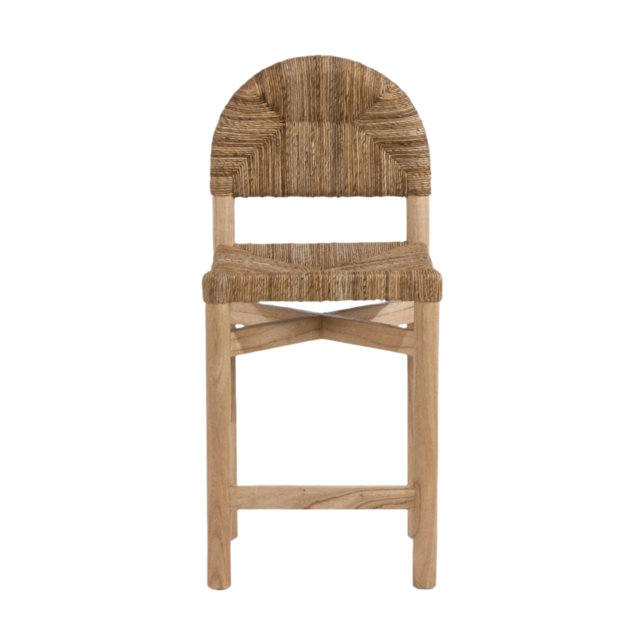 Front view of a coastal counter-height stool with woven natural seagrass seat and rounded back on a light teak frame with crossed stretchers and a wooden footrest.
