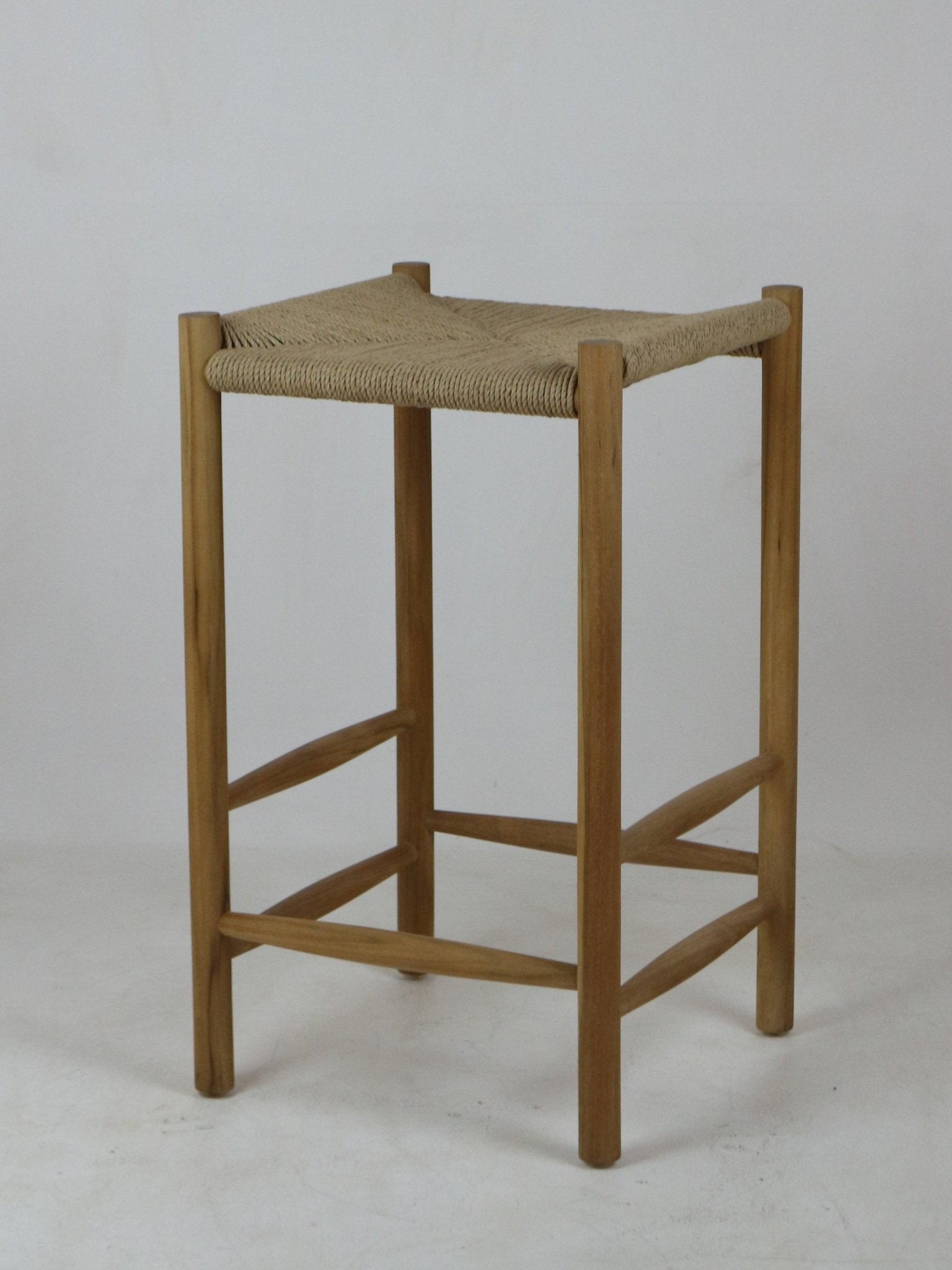 Backless modern bar stool with a natural solid wood frame and woven rope seat in beige, four straight legs joined by cross rails for foot support.