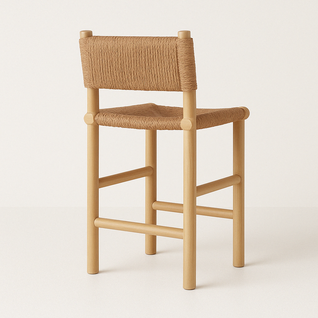 Armless natural teak bar stool with round wood legs and crossbar footrests, featuring a tan woven fiber seat and low rope-wrapped backrest for a coastal, modern farmhouse look.