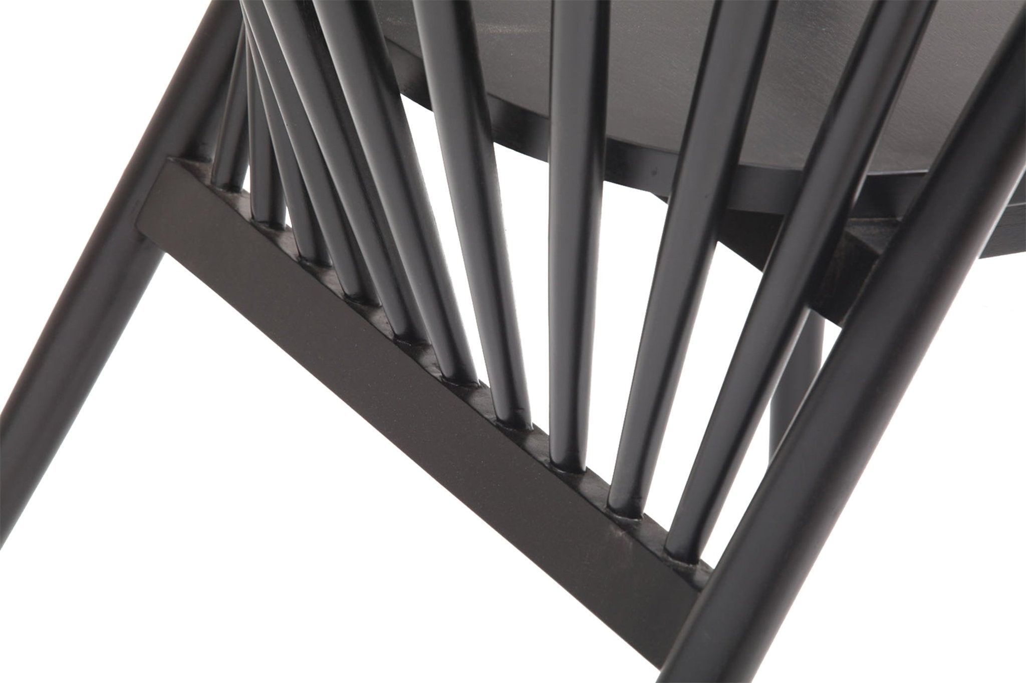 Close-up of a Shaker-style dining chair back showing black gloss solid-wood spindles, a curved lower stretcher and round tapered legs with visible joint details.