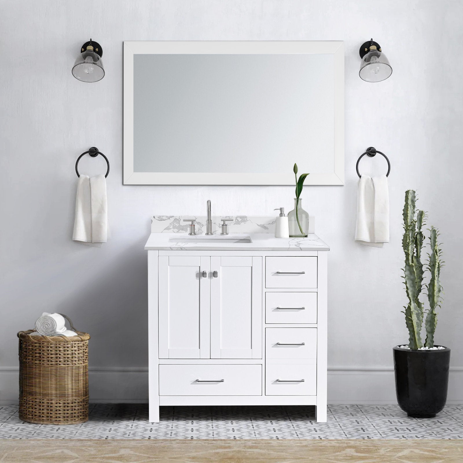 White solid-wood 36-inch single-sink bathroom vanity with a marble-look stone top, undermount sink and chrome faucet, four right-side drawers and center cabinet, styled with a mirror, sconces, towel rings and wicker basket.