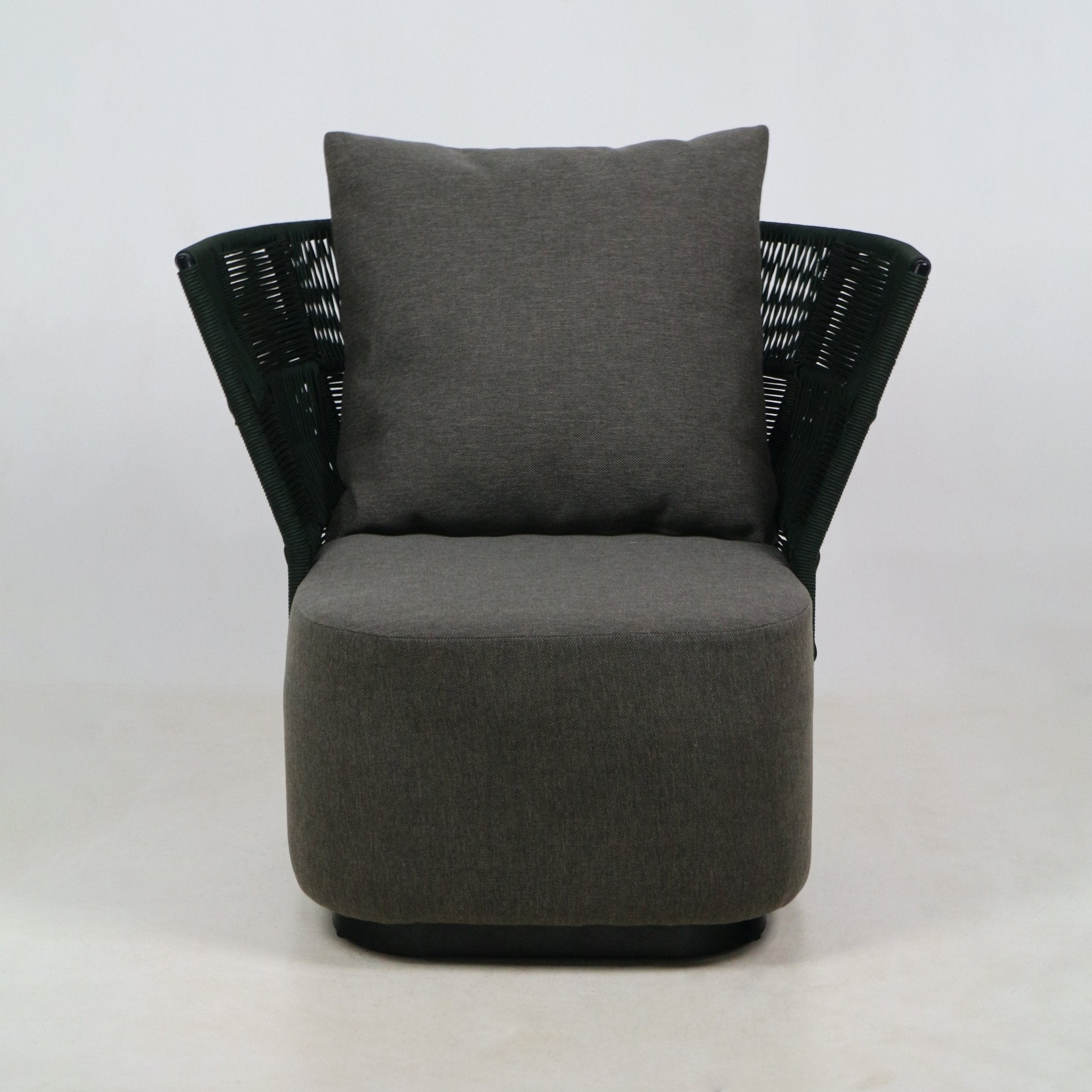 Front view of a coastal-modern outdoor accent chair with gray fabric seat and large gray back cushion, dark woven rope backrest and a low rounded base.