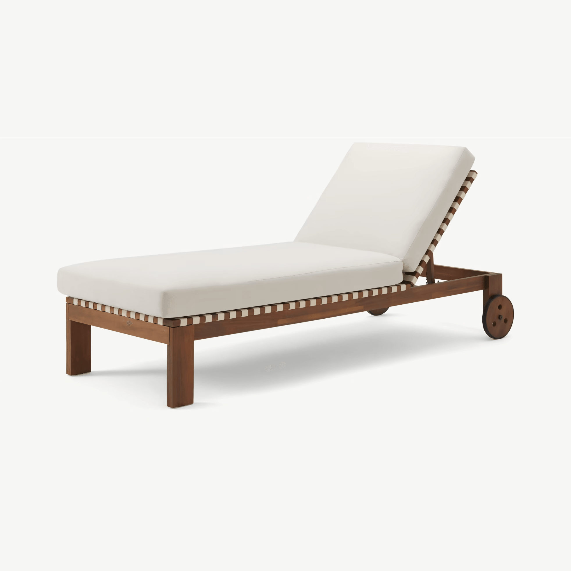 Cream fabric cushion on a teak wood outdoor sun lounger with adjustable backrest, woven cream-and-teak strap detailing and rear wheels, coastal-style cushioned chaise for patio or poolside.